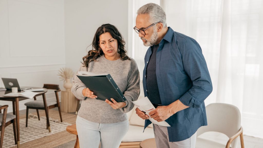Reviewing purchase offers with a Saskatoon real estate agent